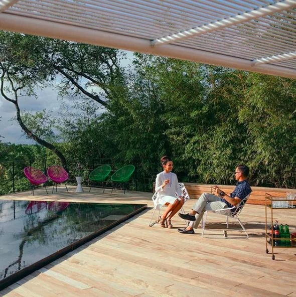 Jan and Keli Sotelo relaxing on a Modern Pools poolside deck
